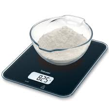 digital weighing scale with white powder in a bowl
