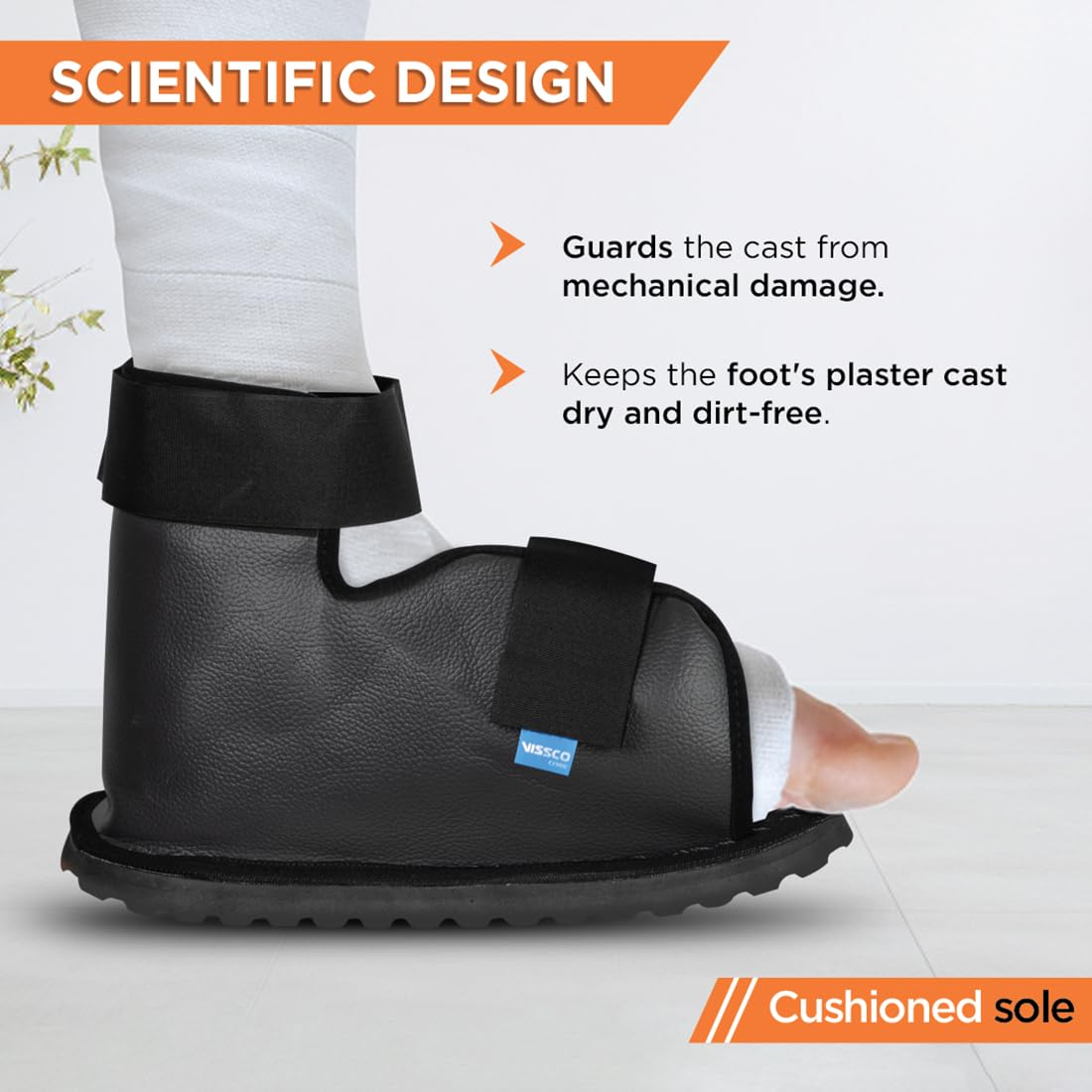 A black Vissco cast walking boot for broken ankle in India protect a plaster cast on the foot, with a cushioned sole and hook and loop closure.