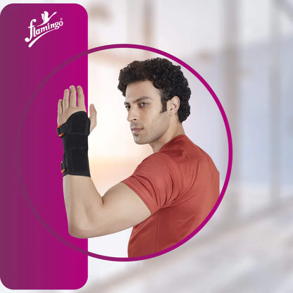 Man wearing a wrist support with a pink Flamingo product in the background