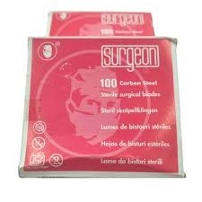 Pack of 100 surgical blades by Surggeon in pink packaging, with high carbon steel description and brand logo.