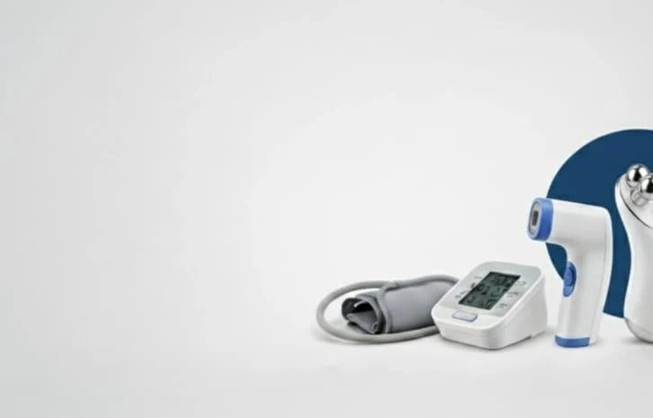 Assorted medical devices including a blood pressure monitor, thermometer, and other tools on a light gray background.